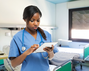 Hospital nurse using a tablet computer
